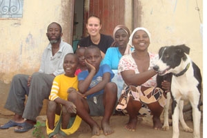 Peace Corps Volunteer Justine Amos '08 in Swaziland with her host family.